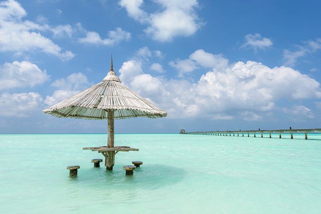 Umbrella in water - Holiday Island, Maldives