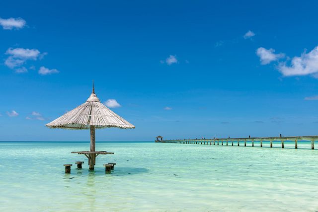 Umbrella in water - Holiday Island, Maldives